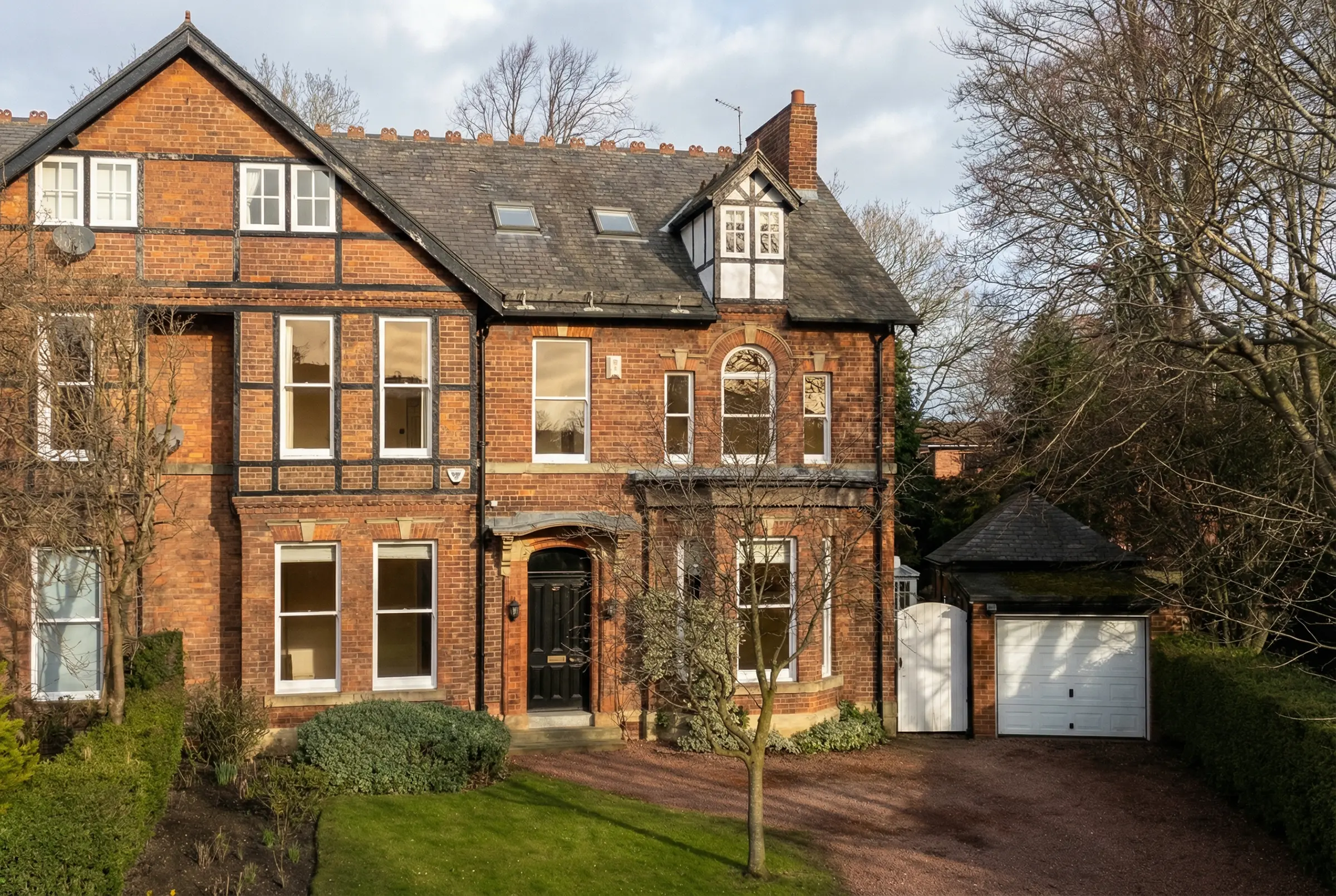 Wide architectural perspective of suburban villas under soft low-sun lighting to conclude the vision sequence.